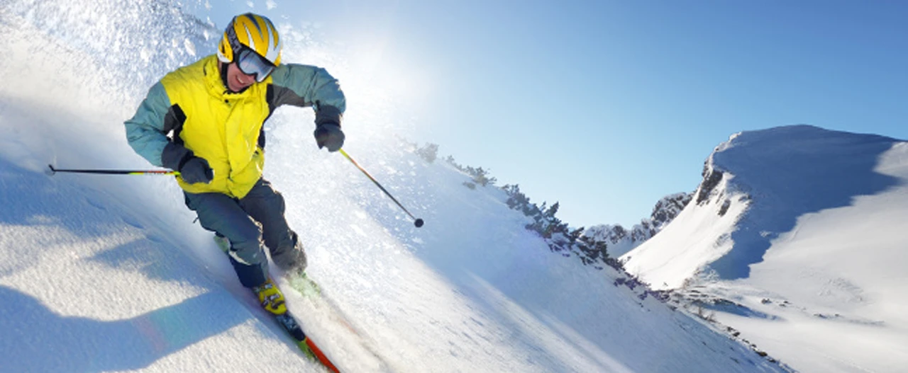 Ski, snow, sun and winter fun - happy family ski team